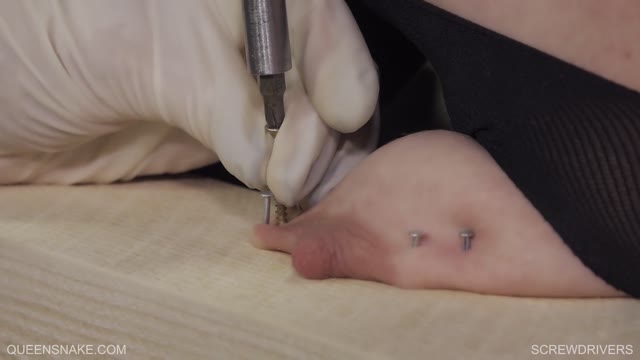 Two domina ladies put screws in their slave s tits